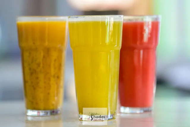 A trio of fresh juices in the daylight garden